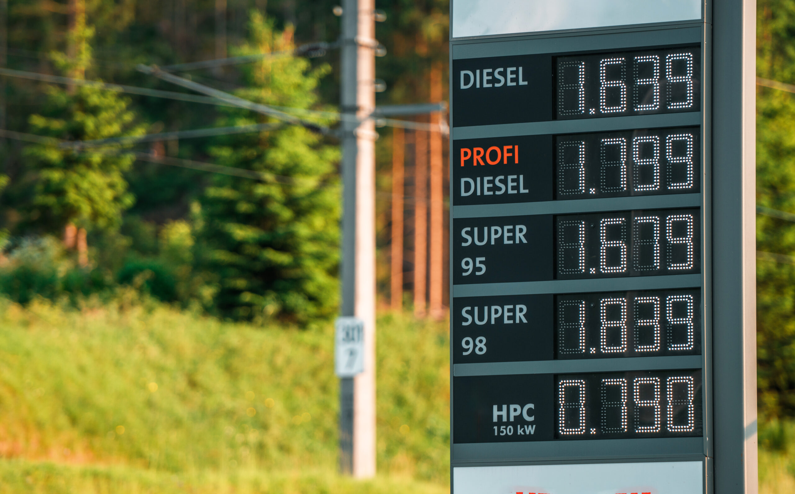 LED Gas Station Pump Toppers.LED petrol pump toppers displaying fuel prices and promotional ads at a modern fuel station.