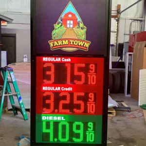 LED Gas Station Pump Toppers.LED Gas Station Pump Toppers.LED petrol pump toppers displaying fuel prices and promotional ads at a modern fuel station.
